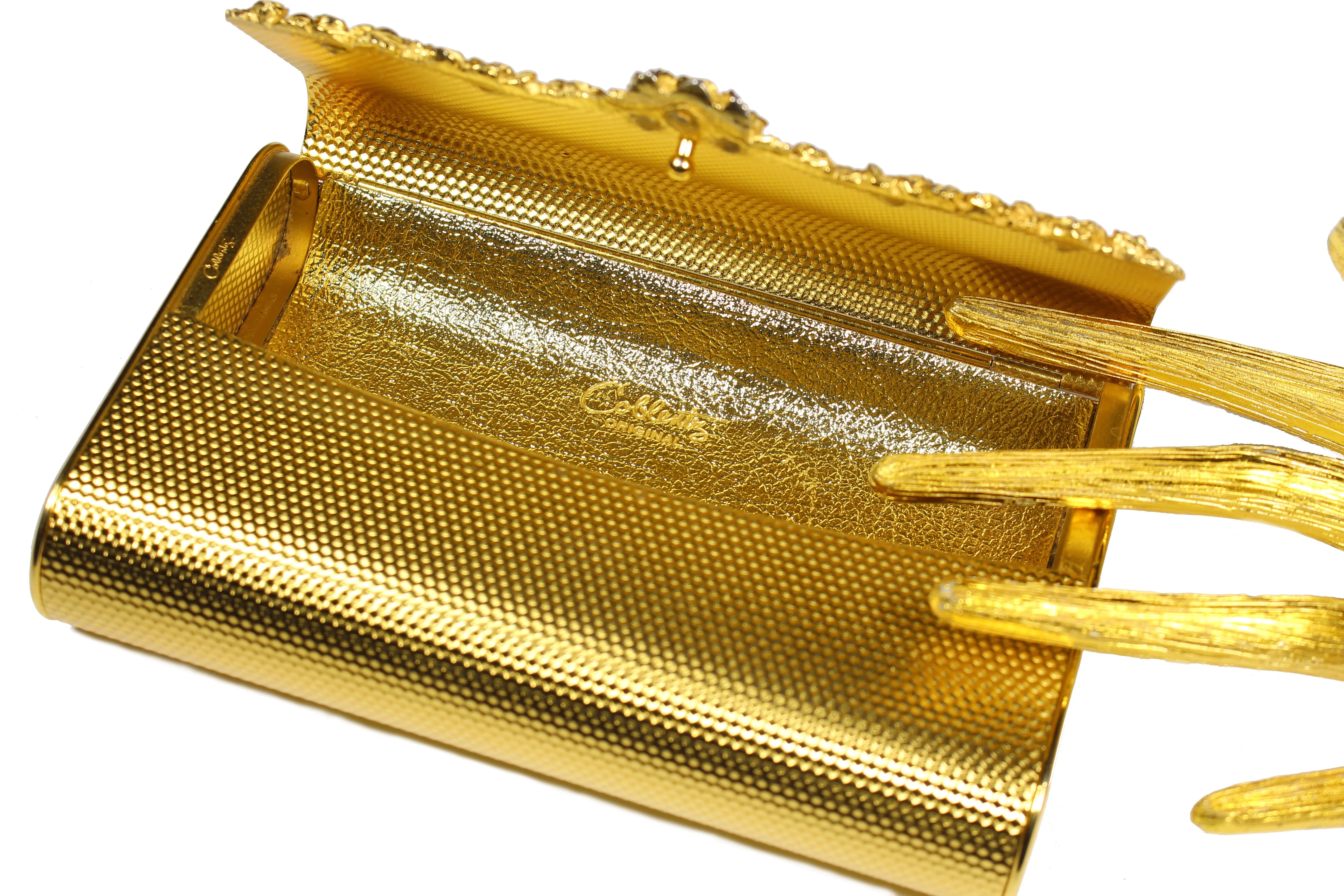 COBLENTZ embossed golden metal clutch